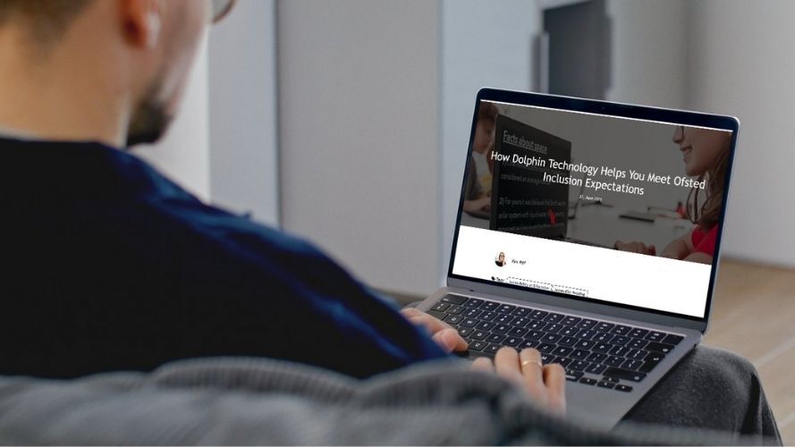 Person reading blog on a laptop
