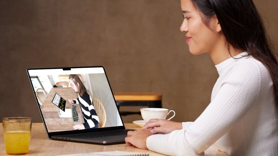 Young lady watching video of Iona using SuperNova