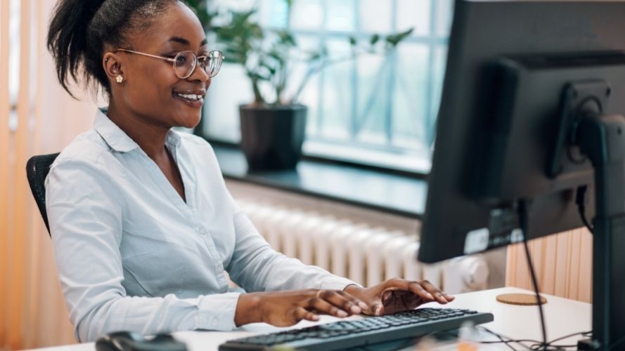 Lady registering for webinar on her desktop computer